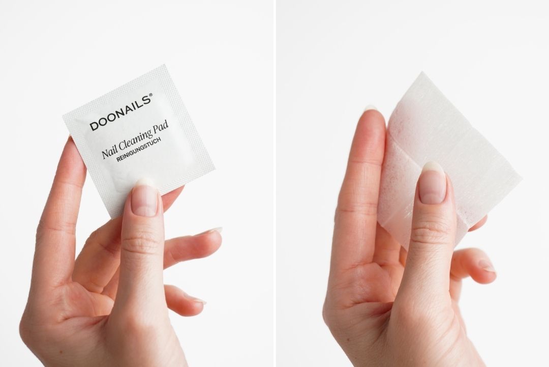 Reinigungstücher in der Hand