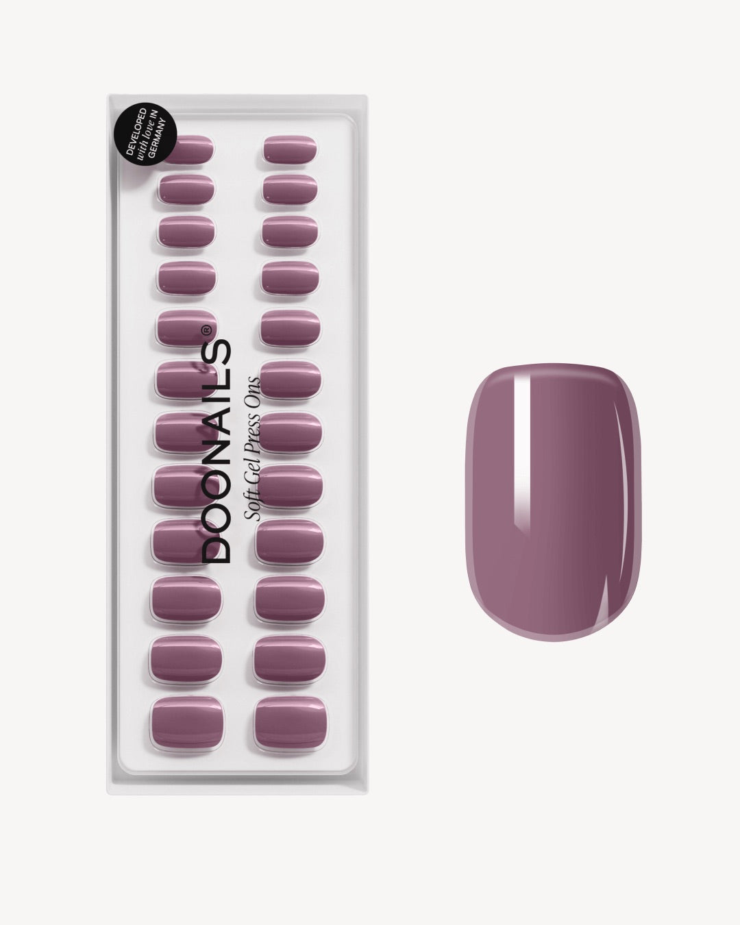 Soft Gel Press Ons Silent Night Mauve auf beigem Hintergrund