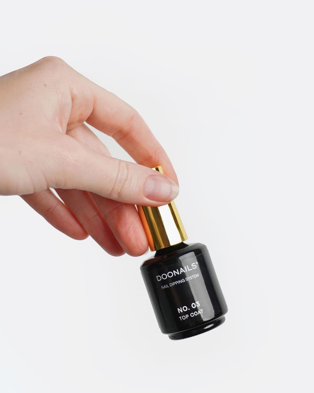 Top Coat in der Hand