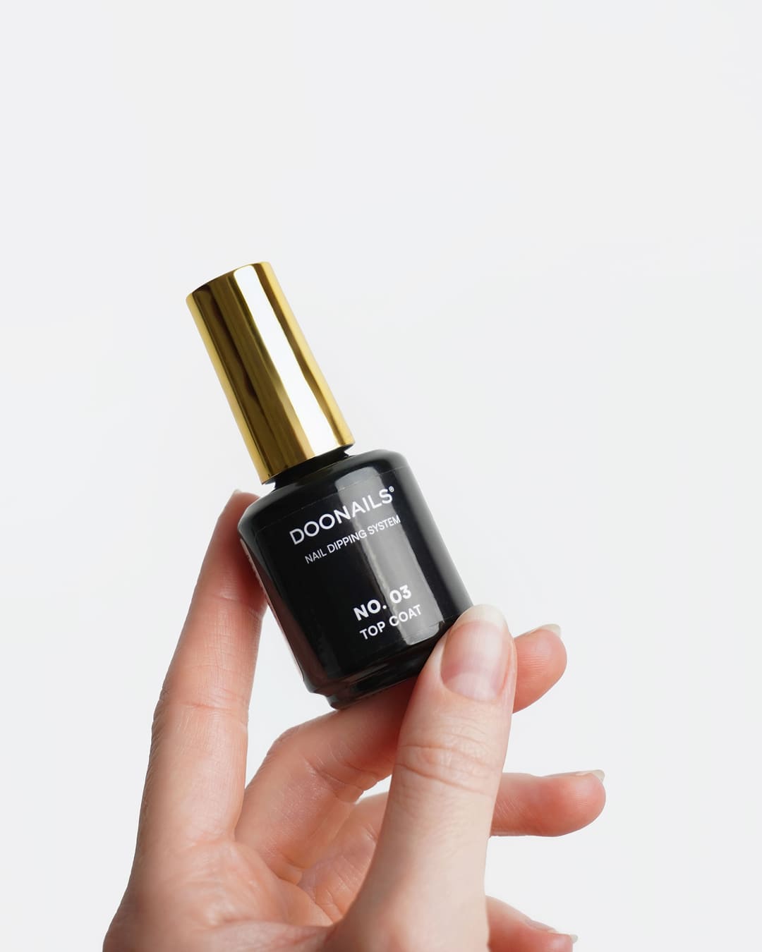 Top Coat in der Hand
