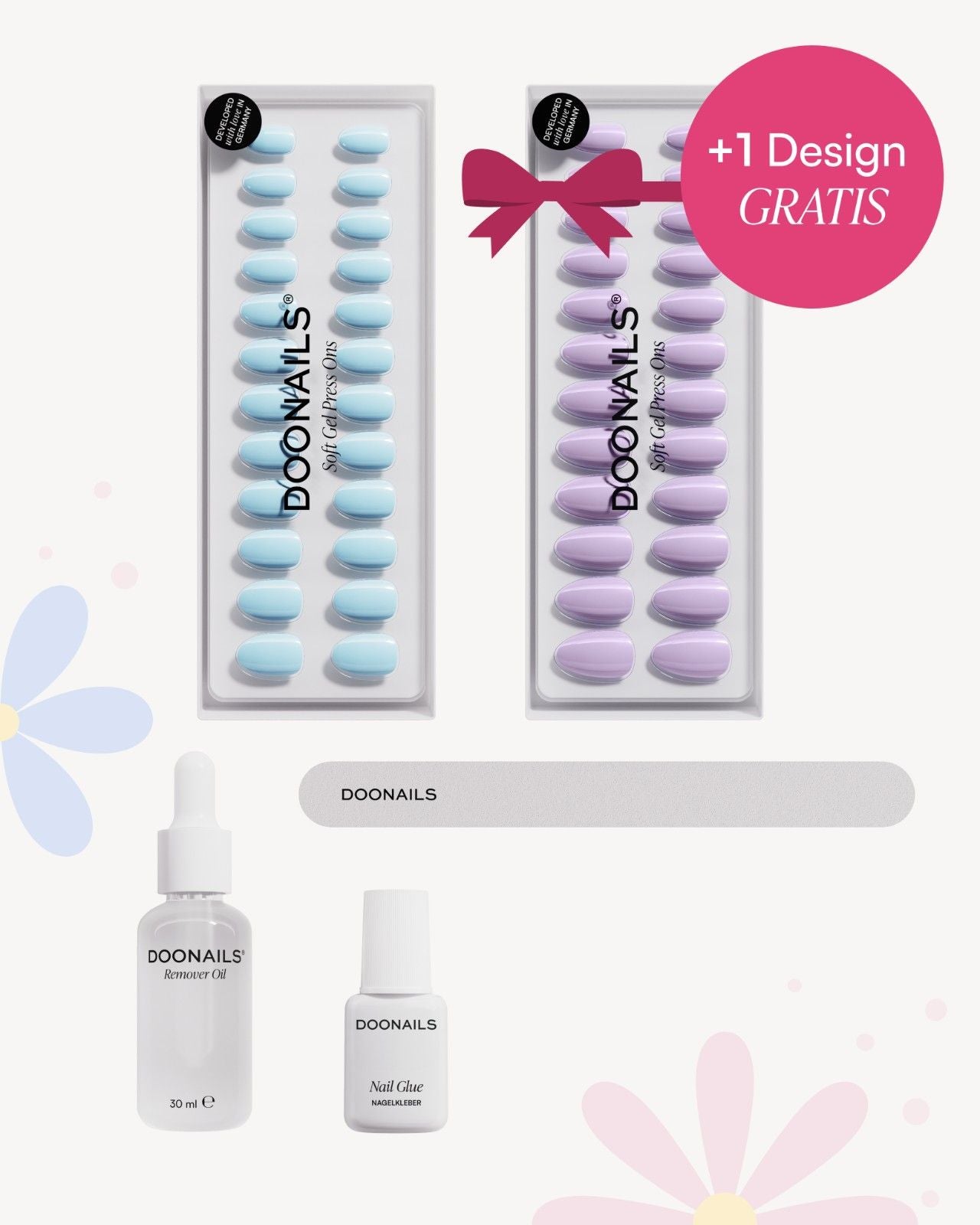 Frühlingshaftes Set mit Blumen und pinken Highlights: Zwei Soft Gel Press Ons, Nagelfeile, Nagelkleber und Entferner Öl.